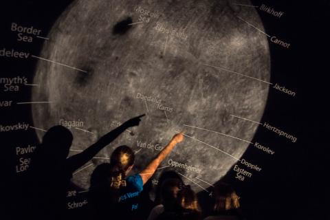 Educator teaching about the moon